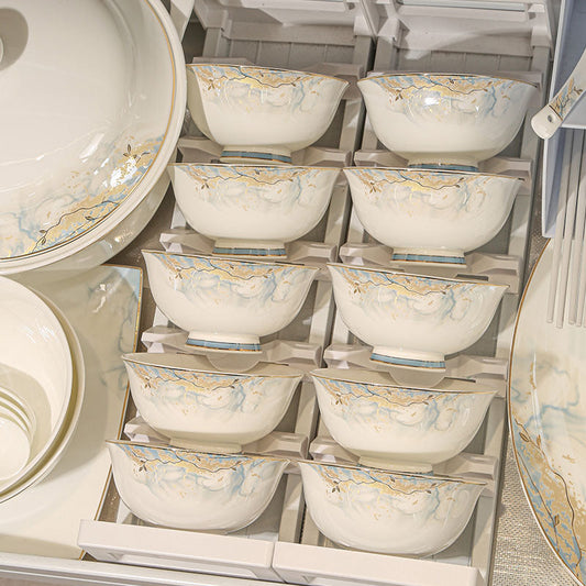 A Jingdezhen Chinese dinnerware set with bowls, plates, spoons, and chopsticks