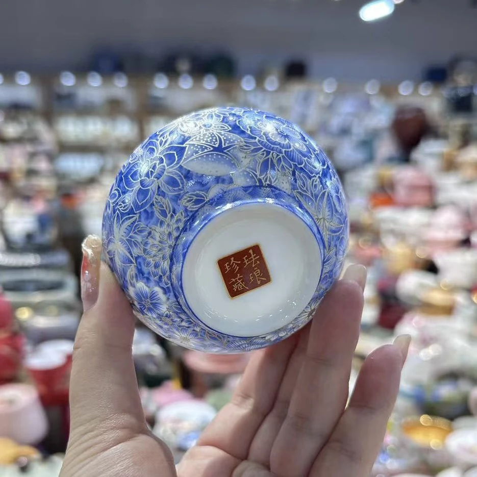 Angled view of the Jingdezhen blue-and-white porcelain tea cup with enamel color