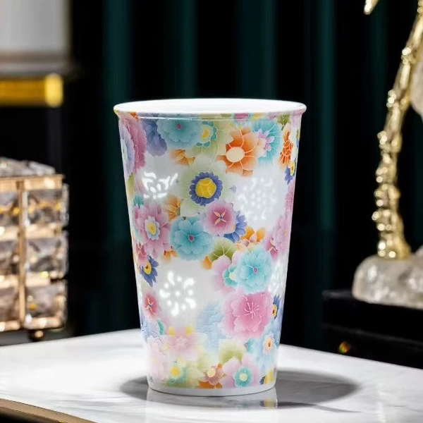 Jingdezhen porcelain mug glowing with backlit rice-grain pattern