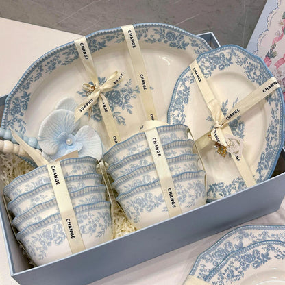 Blue Danube dinnerware set with scalloped bowls, plates, spoons, and chopsticks